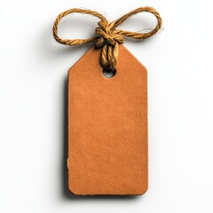 Vibrant orange label tag suspended by a string set against a clean white backdrop ideal for innovative labeling purposes