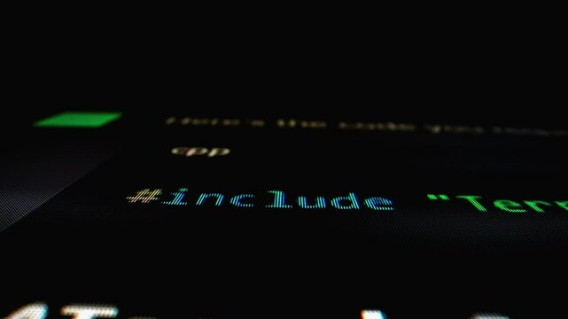 Closeup macro shot movement of coding script moving across LED screen with real-time AI-generated typing, showcasing advanced AI learning in optimization, debug and coding for software development.