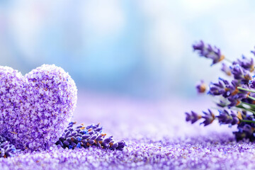Lavender heart and blossoms on purple background