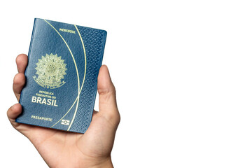 Person holding a Brazilian Passport on white background with copy space.