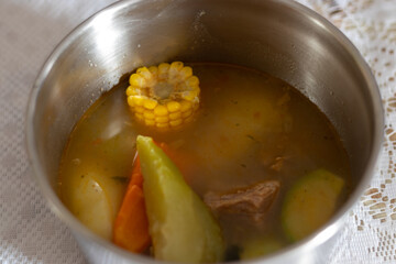 caldo de res, traditional guatemalan food beef broth 