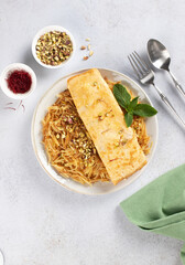 Balaleet - traditional Arabic breakfast. Sweet vermicelli with saffron, cardamom and egg omelette. Arabic, Emirati food.