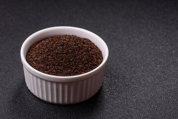 Black tea dry crushed in bowl