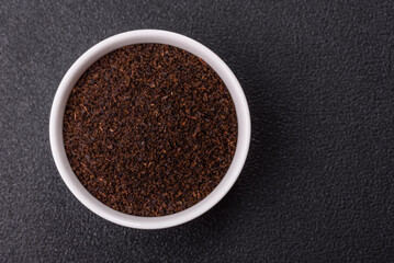Black tea dry crushed in bowl