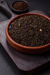 Dry green tea with soursop piece, knapweed petals in bowl