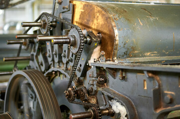 Exploring the intricate mechanics of a carding machine with its engaging assembly and dynamic...
