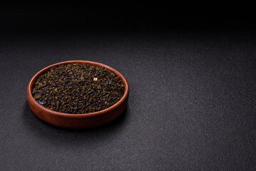 Dry green tea with soursop piece, knapweed petals in bowl