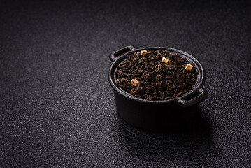 Dry green tea with soursop piece, knapweed petals in bowl
