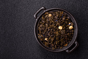 Dry green tea with soursop piece, knapweed petals in bowl