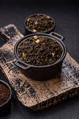 Dry green tea with soursop piece, knapweed petals in bowl