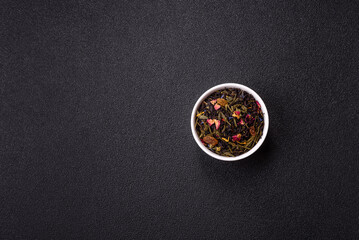 Dry tea mix blend black, green and flower petals in bowl