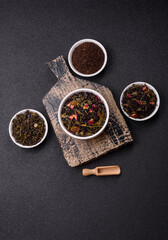 Dry tea mix blend black, green and flower petals in bowl