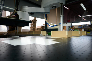 Automated assembly process in a decorative box factory with robots and conveyor system at work