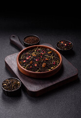 Dry tea mix blend black, green and flower petals in bowl