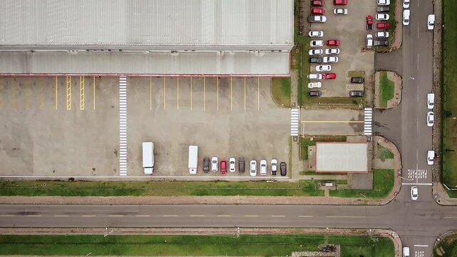 Aerial drone view, top-down perspective of the industrial complex in the city of S&atilde;o Jos&eacute; dos Pinhais, Curitiba, light traffic, cars moving, top view.