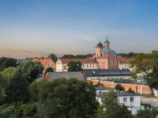 Sunset landscape of Monastery complex (Zepół poklasztorny zgormadzenia Cysterek) and Church of St. John Baptist (Kościół św. Jana Chrzciciela) in Owińska, Poznań County, Greater Poland (WIelkopolska) © uslatar