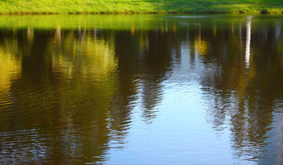 Obraz premium Abstract blue, green reflection wave ripples water landscape. Selective soft focus natural horizontal background.