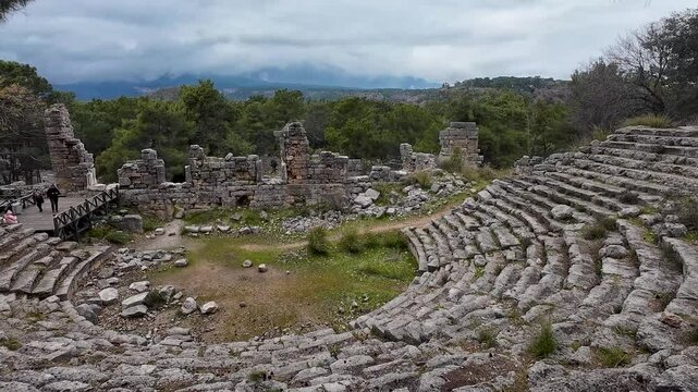 Antalya Phaselis Ancient City. Travel footage among the ruins. A man watching the sea and the view from the beach.