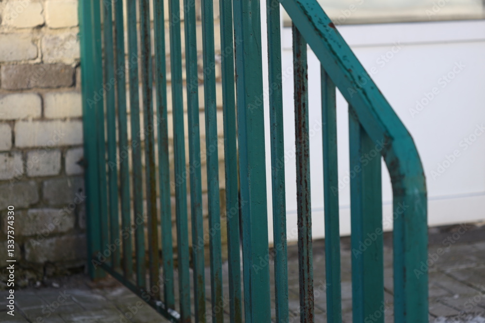 Poster close-up view of a green railing near a building, suitable for architecture or interior design proje