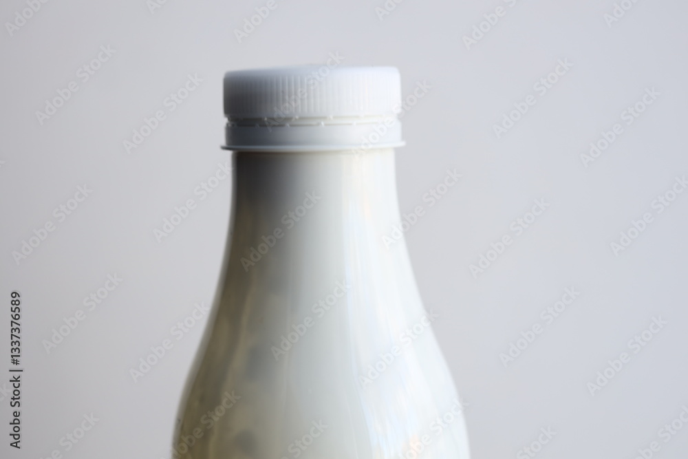 Aufkleber A simple setup with a bottle of milk placed on a table, ready for use.