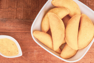 Colombian empanada with spicy sauce 