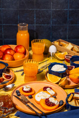 Delicious persimmon, ricotta and blood orange breakfast with fresh orange juice