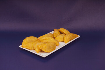 Colombian empanada with spicy sauce 