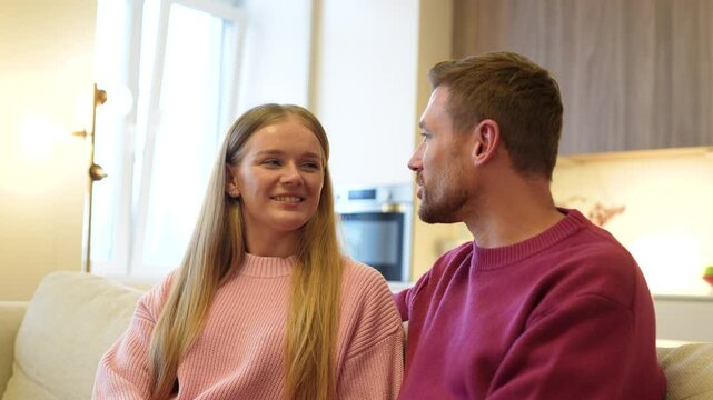 Loving captivated joyful wife gazes at husband opening up emotions, romantic beginnings. Intimacy deepening, trust couple bonding, communication, affectionate listening, admiration, supportive spouse