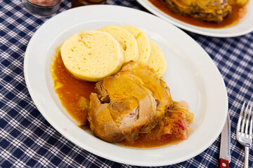 Traditional old Bohemian dumplings served with sauerkraut and baked pork. Dish of Czech cuisine