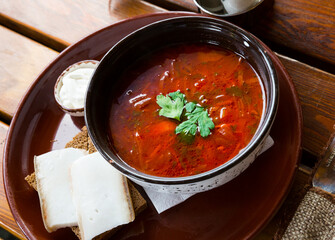 Traditional Russian and Ukrainian dish - borscht served in bowl