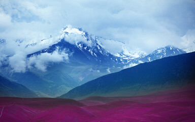Surreal red and blue landscape with hills and mountains