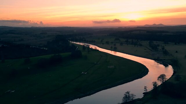 A Stunning Sunset Drone Aerial View Over the River Tweed in Kelso, Scotland