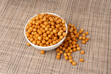 Small pastry balls, fried crispy wheat soup pearls, salad egg puffs or choux pastry