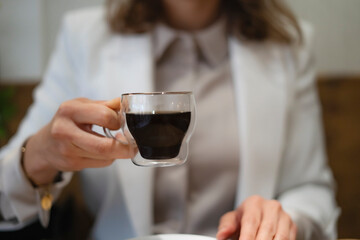Businesswoman holding a cup of coffee during a break