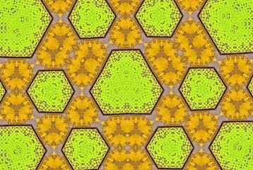 Geometric hexagonal honeycomb pattern in bright green and yellow tones The symmetrical design...