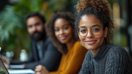 Fototapeta premium Confident Young Woman with Colleagues in Background