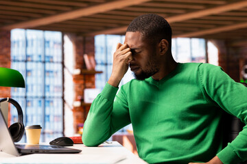 Man at home feeling exhausted and in pain from lack of sleep, suffering from insomnia fatigue....