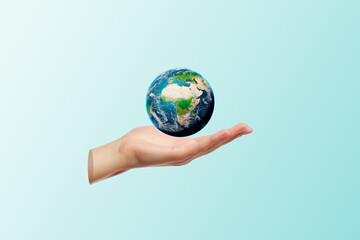 Women Hand Holding Earth Globe