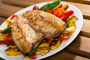 Traditional Bulgarian Plakiya with mackerel served on white plate..