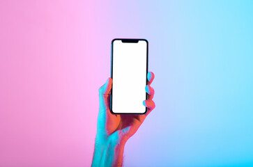 A hand presents a smartphone with a blank screen, set against a vibrant gradient backdrop of pink...