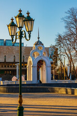 Symbol of Kharkiv city - Mirror Stream and retro lamppost. Architecture in the city center, Ukraine