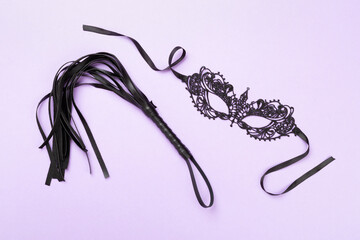 Set of erotic BDSM accessories on color background, top view