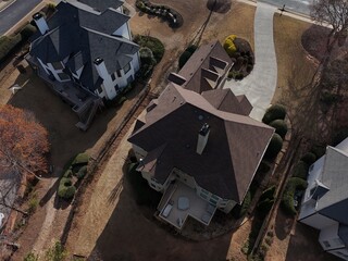Beautiful aerial view of a sub division with golf course and a beautiful lake in suburbs of Atlanta during golden hour.