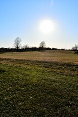 Sun Over a Farm Field