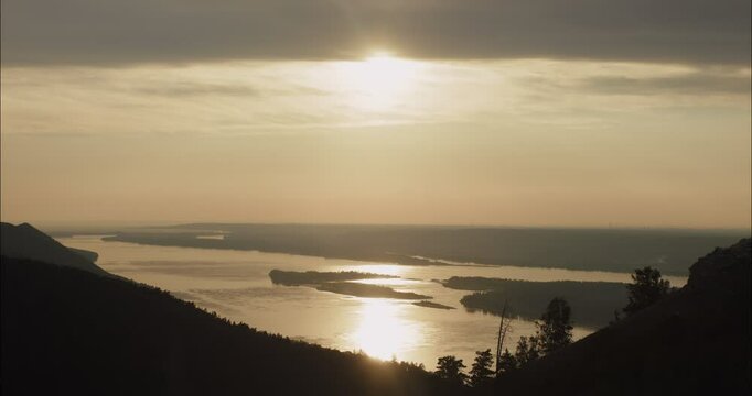Sunlight reflecting on river at sunset with islands