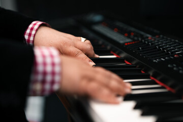 Obraz premium Piano player hands playing keyboard musical instrument music production studio