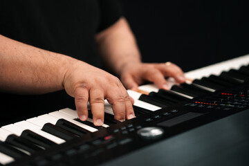 Fototapeta premium Piano player hands playing keyboard musical instrument music production studio