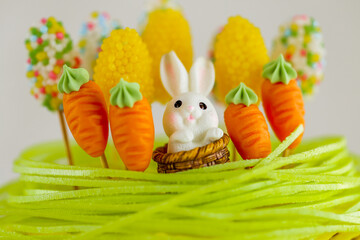  Easter Bunny cake with Carrots and sugar grass.holiday baked goods with sugar decor. Spring festive desserts. Catholic and Orthodox holidays table.