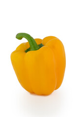Vibrant yellow bell pepper standing alone against a clean white background showcasing its glossy texture and natural beauty