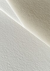 Overlapping and textured layers of white and cream paper